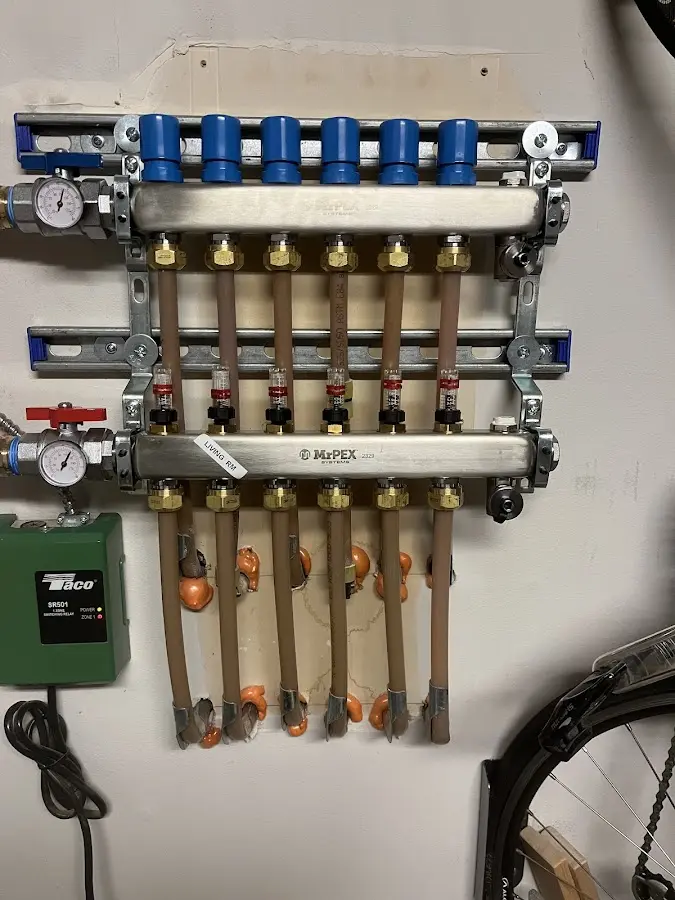 Plumber performing Water Heater Repair at a residential property in Massanetta Springs